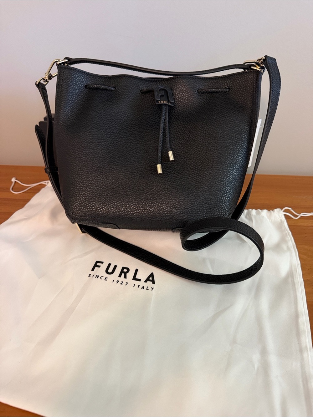 Furla Atena Black Pebbled Leather Bucket Crossbody with Gold-Tone Accents